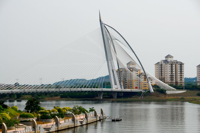 Amazing 8 Attractions Half-Day Putrajaya City Tour - The pink Putra Mosque beside the lake
