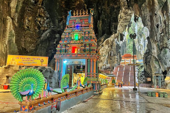 Batu Caves Twilight and Little India Evening Tour - The glowing scenes inside Ramayana Cave