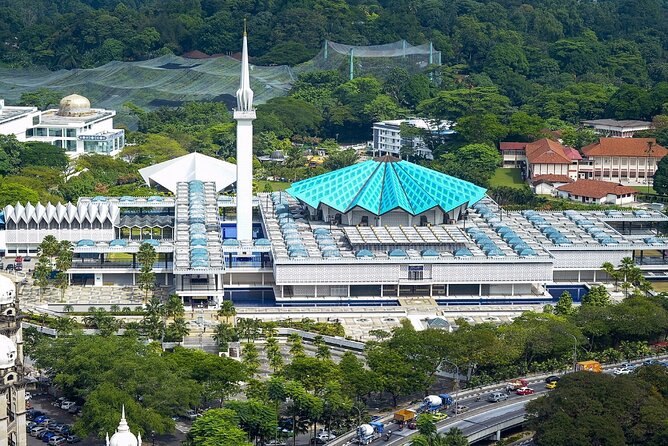 Private Kuala Lumpur Photographic Tour With Petronas Towers - The National Monument adds history in bronze